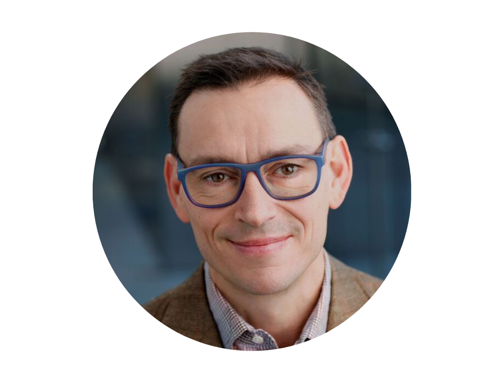 Headshot of white man in glasses